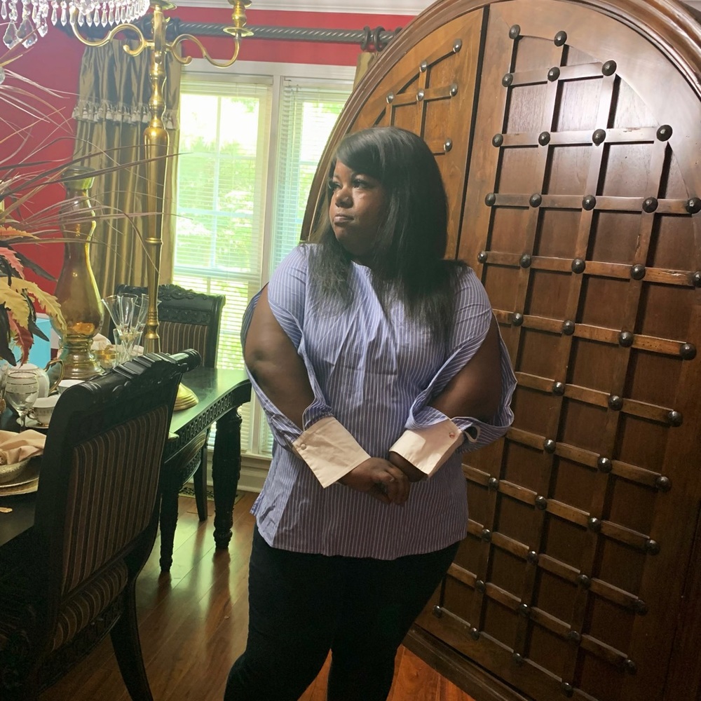 Long sleeve striped shirt with open arms. Zipper in back.